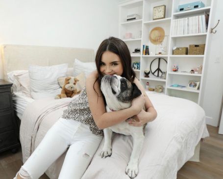 Landry Bender with her pet dog, Blithe.